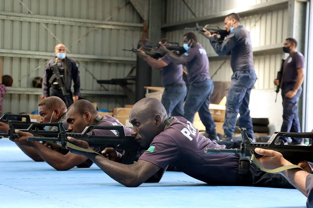 Chinese police liaison officers train with officers of the Royal Solomon Islands Police Force last year. The Pacific nation’s leader signed an agreement this week allowing China to maintain a police presence there until 2025. Photo: RSIPF Handout via AFP Chinese police liaison officers train with officers of the Royal Solomon Islands Police Force last year. The Pacific nation’s leader signed an agreement this week allowing China to maintain a police presence there until 2025. Photo: RSIPF Handout via AFP