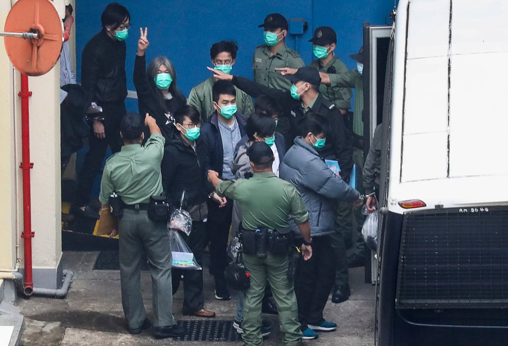 Opposition activists are escorted to a prison van at the Lai Chi Kok Reception Centre. A national security trial involving 47 opposition figures, the biggest to date, is likely to proceed through the courts this year. Photo: Dickson Lee Opposition activists are escorted to a prison van at the Lai Chi Kok Reception Centre. A national security trial involving 47 opposition figures, the biggest to date, is likely to proceed through the courts this year. Photo: Dickson Lee