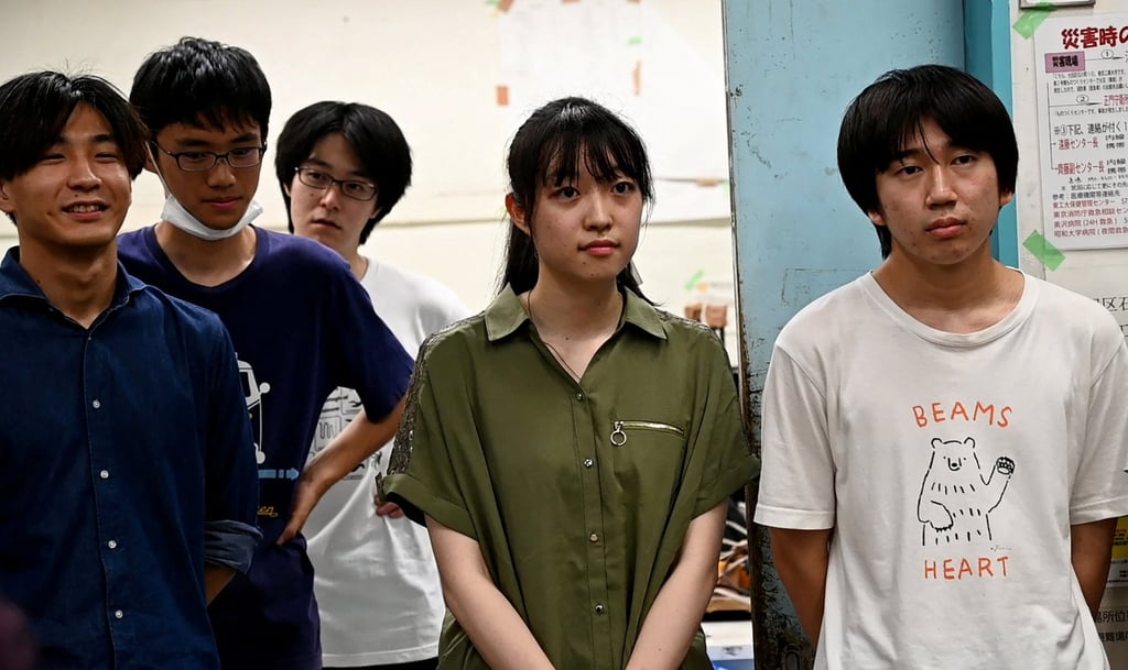 Yuna Kato works with male students at her college club. She says relatives have tried to steer her away from science, technology, engineering and mathematics, on the notion that women in the STEM field are too busy at work to juggle dating or families. Photo: Reuters