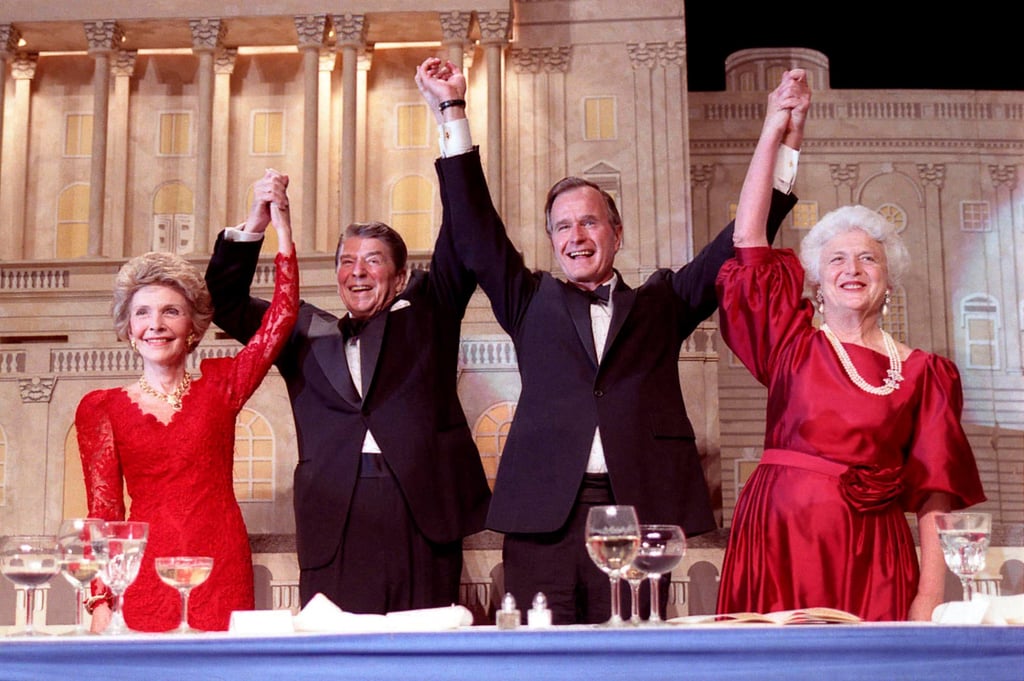 US president Ronald Reagan (second left) and vice-president George H.W. Bush (second right), accompanied by their wives Nancy (left) and Barbara, join hands after Reagan endorses Bush’s run for the presidency during the President’s Dinner in Washington on May 11, 1988. Photo: Reuters