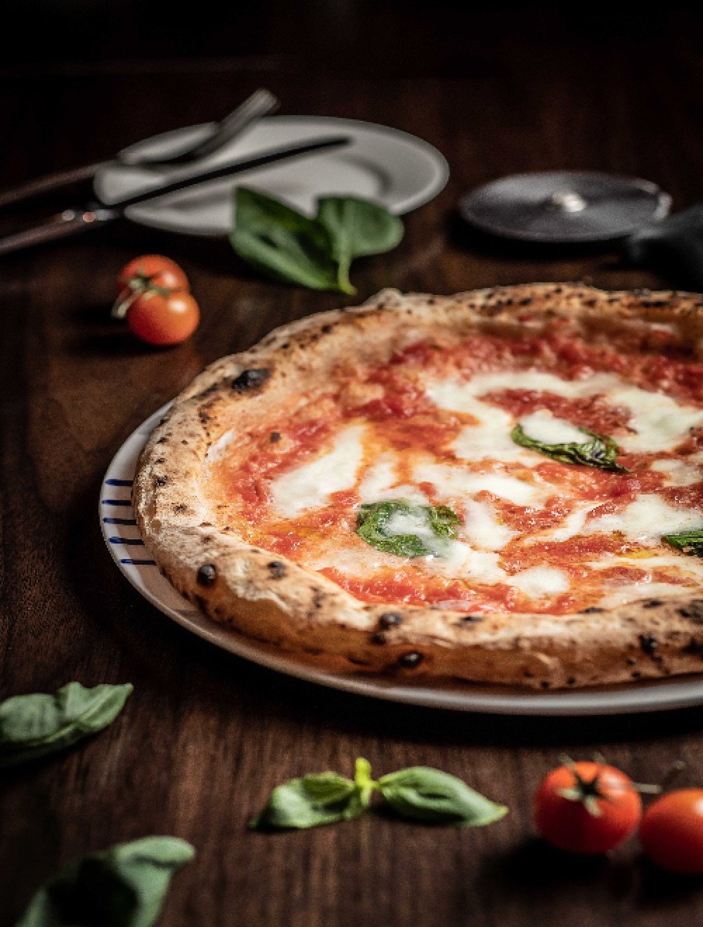 Pizza with San Marzano tomato sauce, mozzarella and fresh basil - True and authentic Italian cuisine. Photo: Handout
