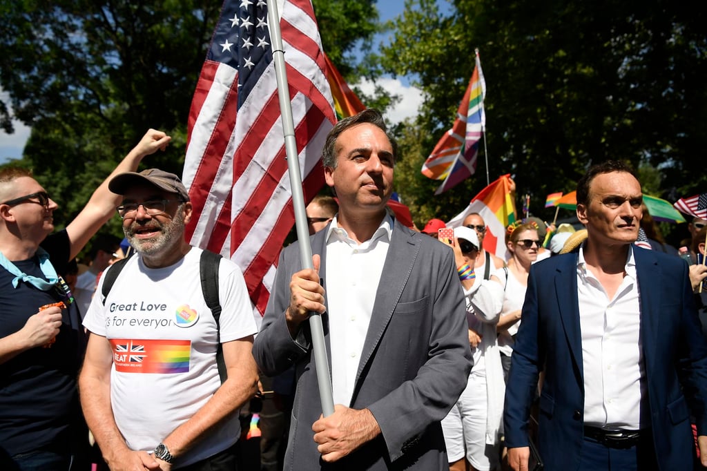 US Ambassador to Hungary David Pressman holds his country’s flag as he participates in the 28th Budapest Pride parade in Budapest, Hungary, Saturday, July 15, 2023. (Tamas Kovacs/MTI via AP)