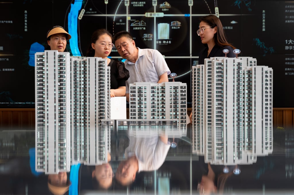 Potential homebuyers look at the models of the residential buildings at a property sales office in Taiyuan, China’s Shanxi province, on June 21, 2023. Photo: CNS