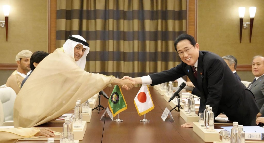 Kishida shakes hands with Jasem al-Budaiwi, secretary general of the Gulf Cooperation Council of energy-exporting Arab monarchies, before their talks in Jeddah at the weekend. Photo: Kyodo