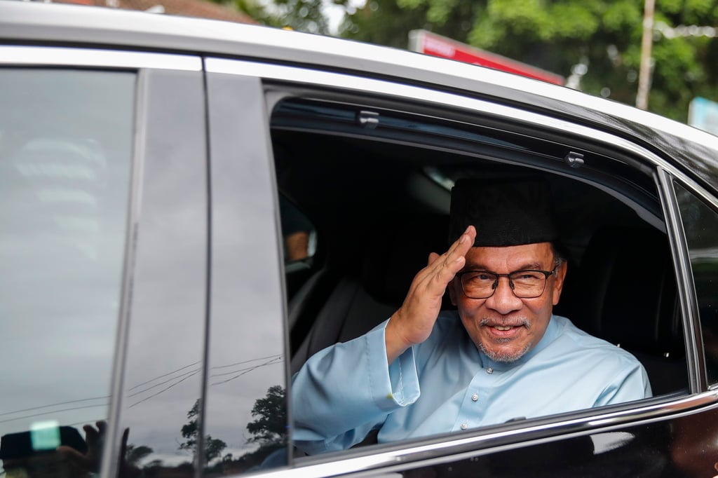 Malaysia’s Prime Minister Anwar Ibrahim leaves a mosque after Friday prayers last week. Kedah Chief Minister Muhammad Sanusi Md Nor will also face trial for allegedly questioning Anwar’s unity government. Photo: EPA-EFE