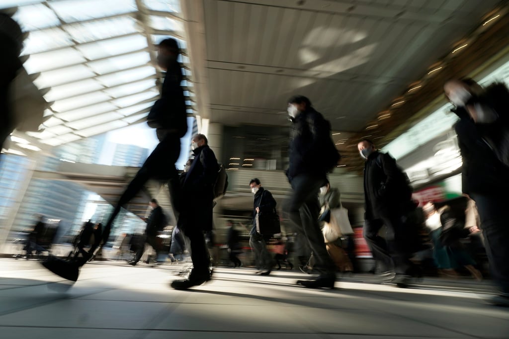 Commuters makes their way through a railway station in Tokyo during rush hour. Just 1.3 per cent of survey respondents said they were happy to go back to a traditional work schedule. Photo: AP Commuters makes their way through a railway station in Tokyo during rush hour. Just 1.3 per cent of survey respondents said they were happy to go back to a traditional work schedule. Photo: AP