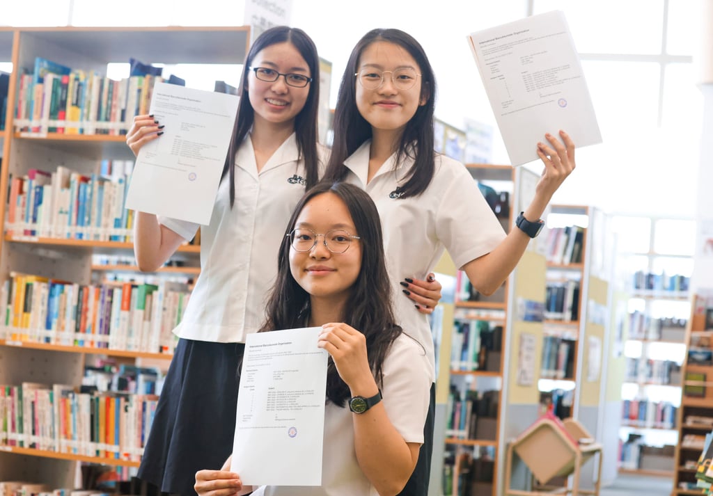 These International Baccalaureate students from Po Leung Kuk Choi Kai Yau School achieved the maximum score of 45 points. Displaying their results at their Sham Shui Po campus, they are (clockwise from front): Macy Chiu King-yau, Katrina Ng Yui-ting and Eunice Lee See-heng. Photo: Nora Tam