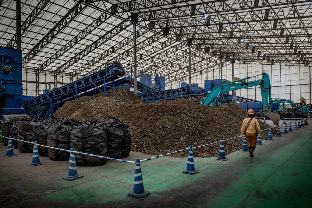 Inside the storage facility in Okuma, Fukushima prefecture, which holds topsoil and plants, vehicles and rubble coated in radiation released from the reactors. Photo: Getty Images