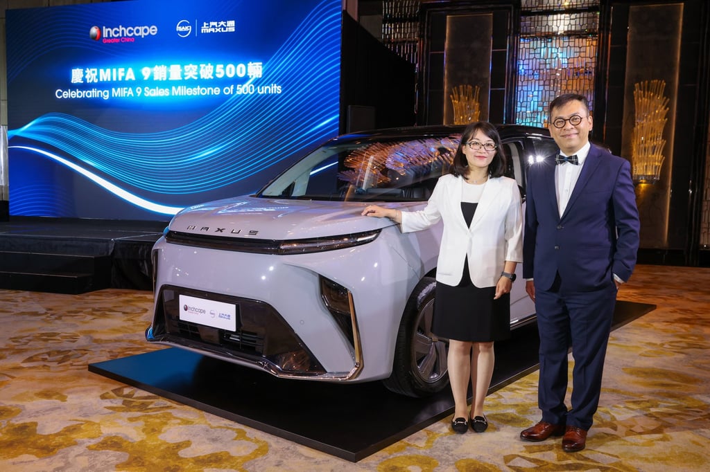Amanda Yan, general manager of the overseas department of SAIC Maxus (left) and Ted Lau, managing director of Inchcape Greater China (right), pose by the SAIC MAXUS MIFA 9 in Hong Kong. Photo: Handout