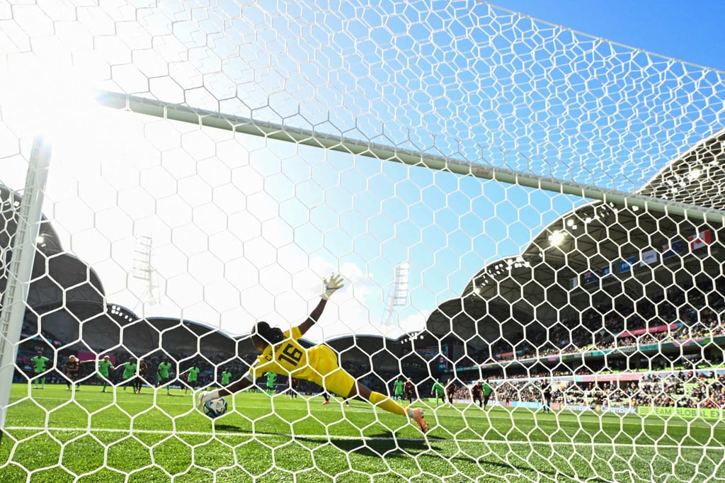 Nigeria’s Chiamaka Nnadozie saves Christine Sinclair’s penalty. Photo: AFP