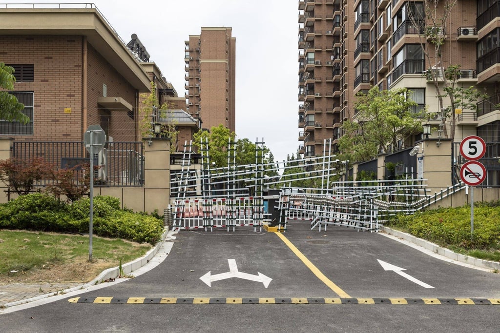 Barricades from recent Covid-related lockdowns block an entrance leading to Country Garden‘s Fengming Haishang residential development in Shanghai, China. Photo: Bloomberg Barricades from recent Covid-related lockdowns block an entrance leading to Country Garden‘s Fengming Haishang residential development in Shanghai, China. Photo: Bloomberg