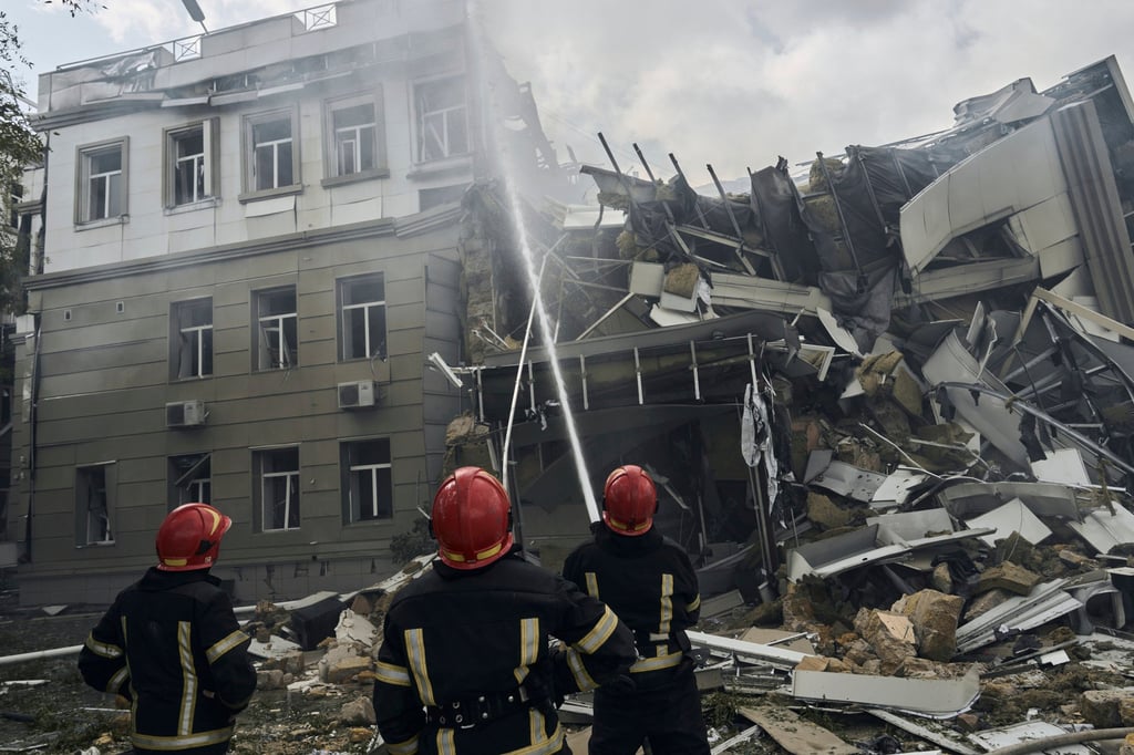Emergency service personnel work at the site of a destroyed building after a Russian attack in Odesa, Ukraine on Thursday. Photo: AP Emergency service personnel work at the site of a destroyed building after a Russian attack in Odesa, Ukraine on Thursday. Photo: AP