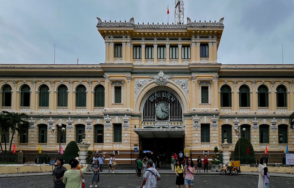 Tourists outside Saigon Central Post Office in Ho Chi Minh City, Vietnam. Photo: Denise Tsang Tourists outside Saigon Central Post Office in Ho Chi Minh City, Vietnam. Photo: Denise Tsang