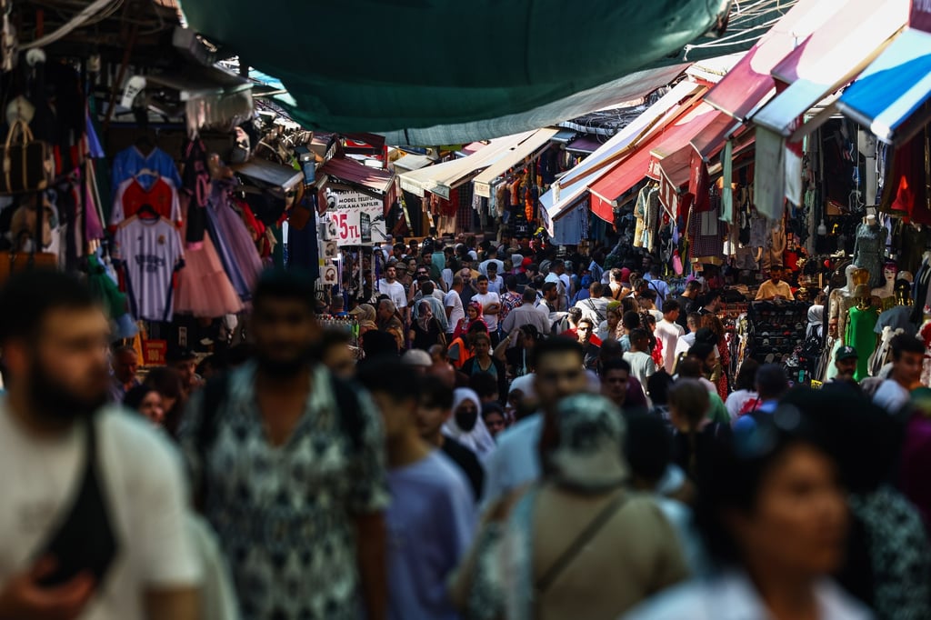People walk through the old city bazaar in Istanbul. Turkey secured US$11.5 billion in financial assistance from the UAE to help shore up its battered economy. Photo: EPA-EFE