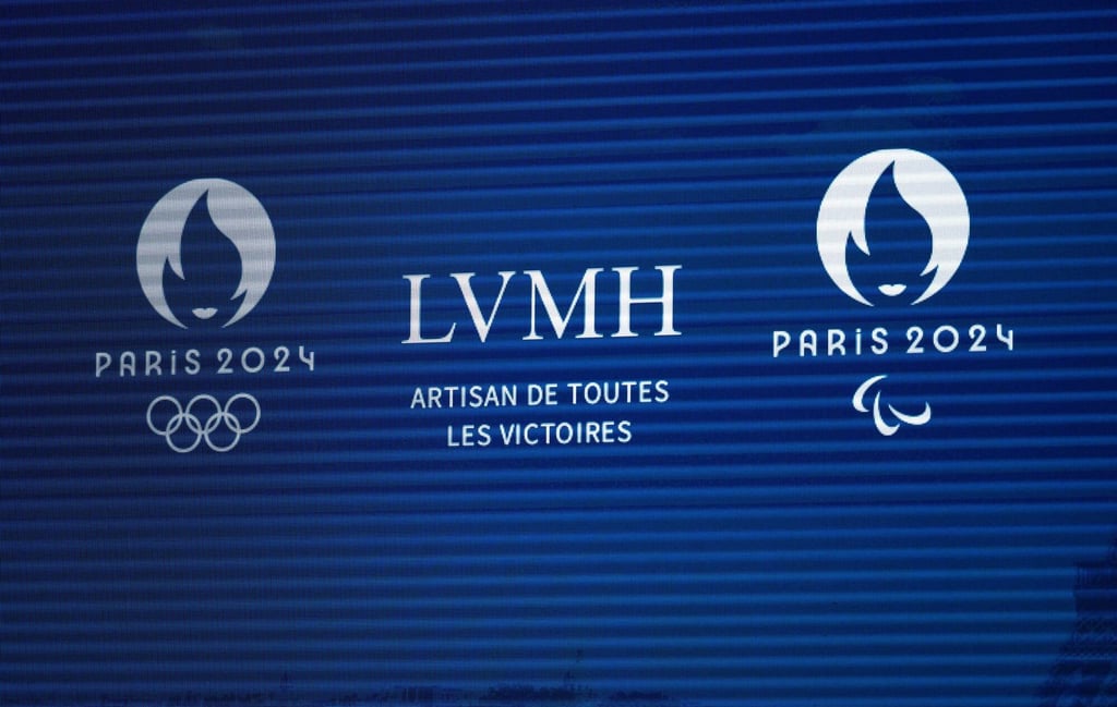 LVMH and Paris 2024 logos displayed during an LVMH Moët Hennessy Louis Vuitton SE news conference in Paris, France, on July 24, 2023. Photo: Bloomberg LVMH and Paris 2024 logos displayed during an LVMH Moët Hennessy Louis Vuitton SE news conference in Paris, France, on July 24, 2023. Photo: Bloomberg