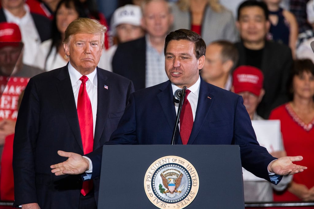 Florida politician Ron DeSantis speaks with Donald Trump at a campaign rally at the Pensacola International Airport in Florida in November 2018. Photo: TNS Florida politician Ron DeSantis speaks with Donald Trump at a campaign rally at the Pensacola International Airport in Florida in November 2018. Photo: TNS