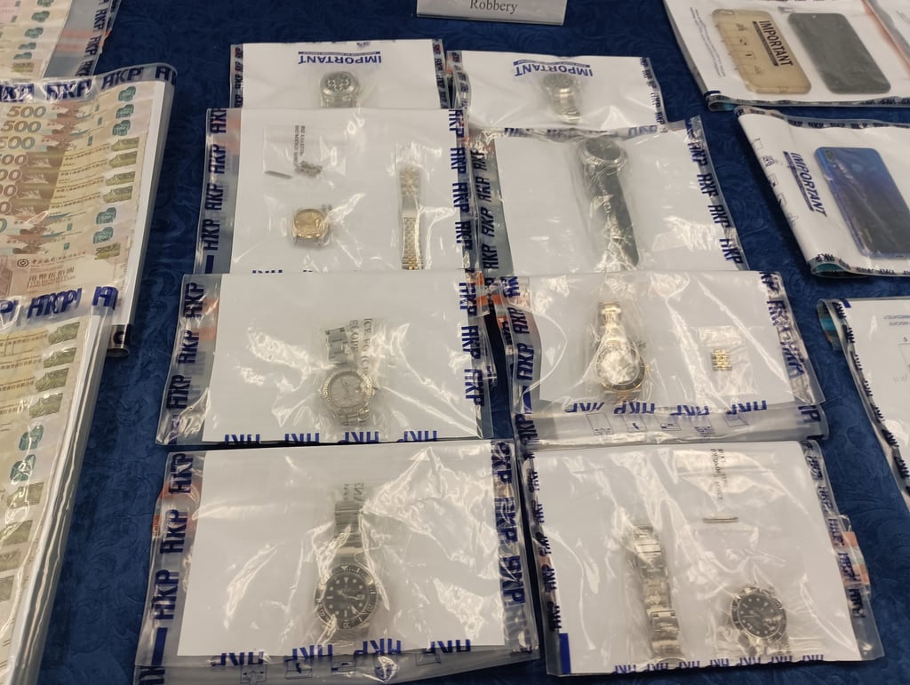 Police display the watches seized in the raids. Photo: Handout Police display the watches seized in the raids. Photo: Handout
