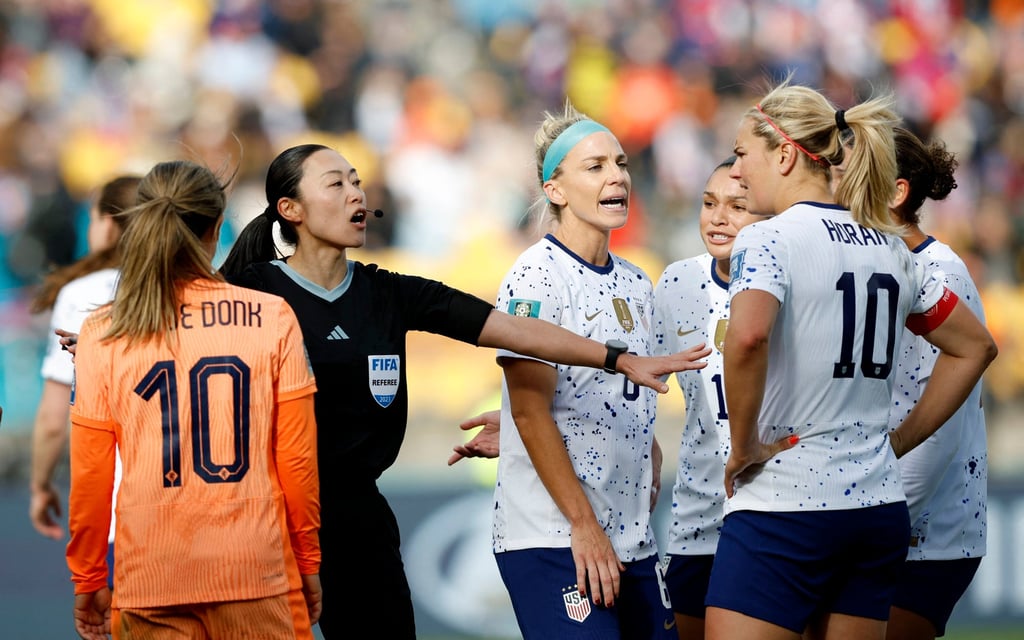 Referee Yoshimi Yamashita steps between Lindsey Horan and the Netherlands’ Danielle van de Donk. Photo: Reuters Referee Yoshimi Yamashita steps between Lindsey Horan and the Netherlands’ Danielle van de Donk. Photo: Reuters