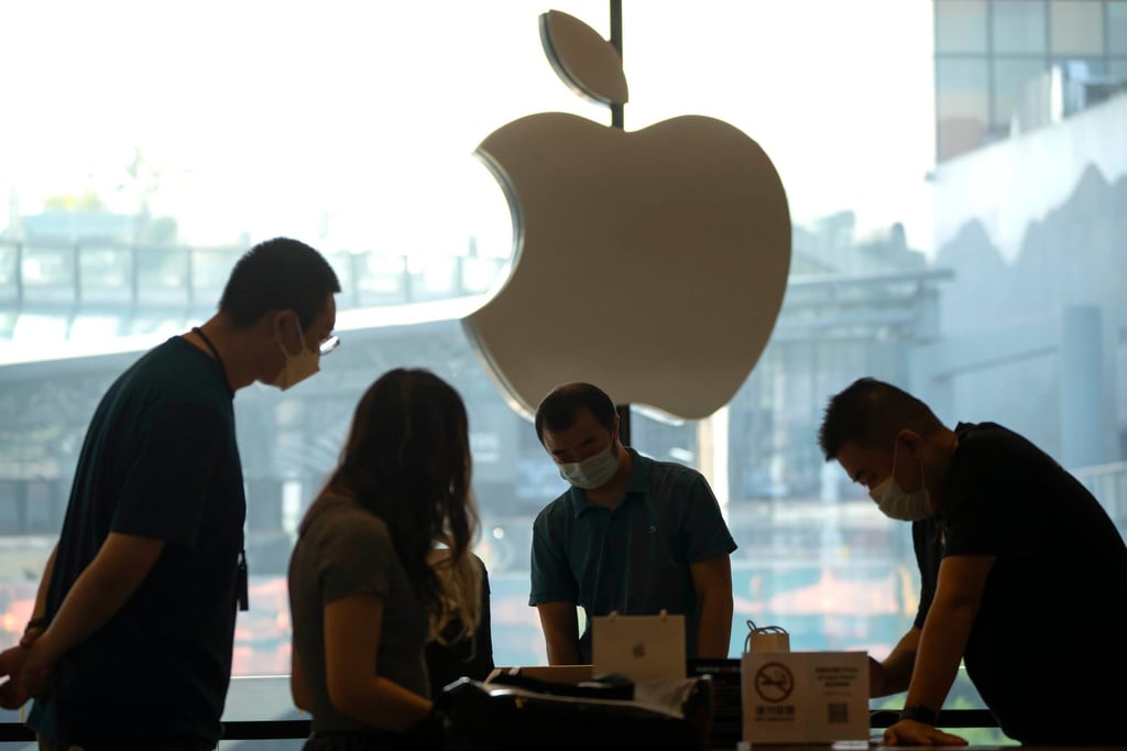 Shoppers check out iPhone 14 models on display at an Apple Store in Beijing on September 16, 2022. Apple was China’s fourth-largest smartphone vendor in the second quarter this year. Photo: AP