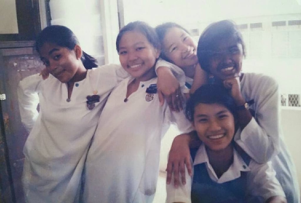Adele Lim with her high school classmates in Malaysia. Photo: @adeleblim/Instagram