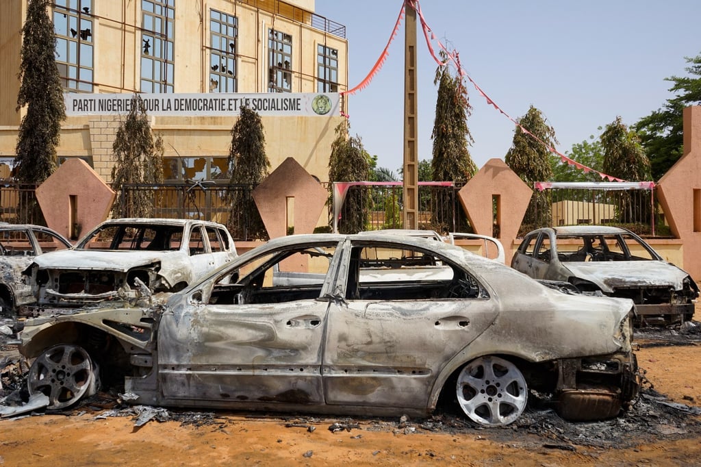 Torched cars sit in front of the headquarters of the Nigerien Party for Democracy and Socialism, which was damaged during anti-government protests on Thursday in Niamey, Niger. Photo: EPA-EFE Torched cars sit in front of the headquarters of the Nigerien Party for Democracy and Socialism, which was damaged during anti-government protests on Thursday in Niamey, Niger. Photo: EPA-EFE