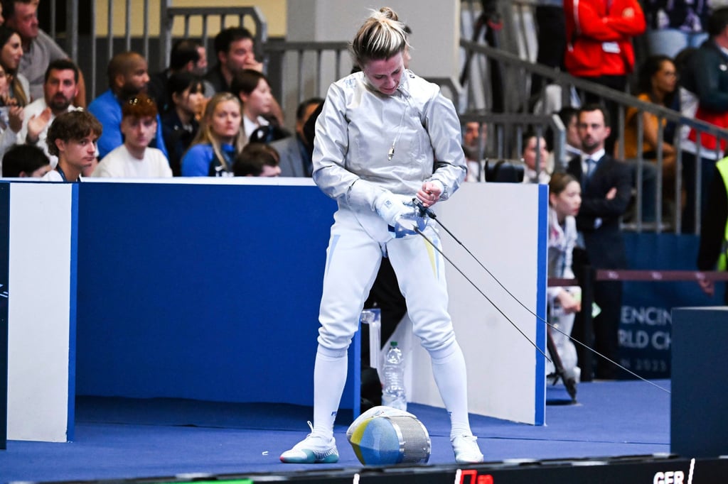 Ukraine’s Olga Kharlan leaves after her bout with Russia’s Anna Smirnova during the FIE World Fencing Championship, in Milan. Photo: AP