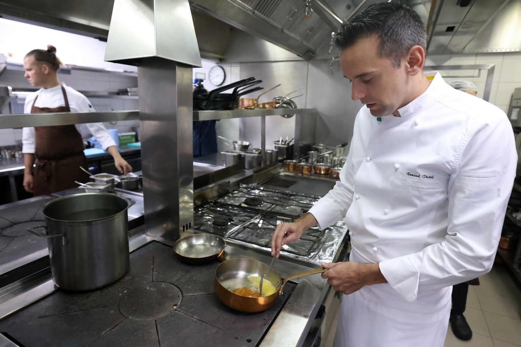Renaud Dutel prepares a dish at Stay by Yannick Alléno. Photo: AFP