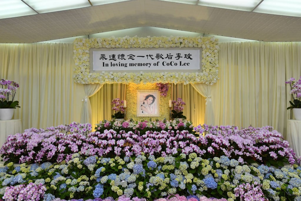 Flowers are laid out in front of a portrait of the singer at the Hong Kong Funeral Home in North Point. Photo: Handout Flowers are laid out in front of a portrait of the singer at the Hong Kong Funeral Home in North Point. Photo: Handout