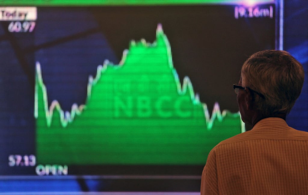 A man checks a screen displaying market updates inside the Bombay Stock Exchange building in Mumbai. India’s benchmark stock indexes hit record highs this month. Photo: Reuters A man checks a screen displaying market updates inside the Bombay Stock Exchange building in Mumbai. India’s benchmark stock indexes hit record highs this month. Photo: Reuters