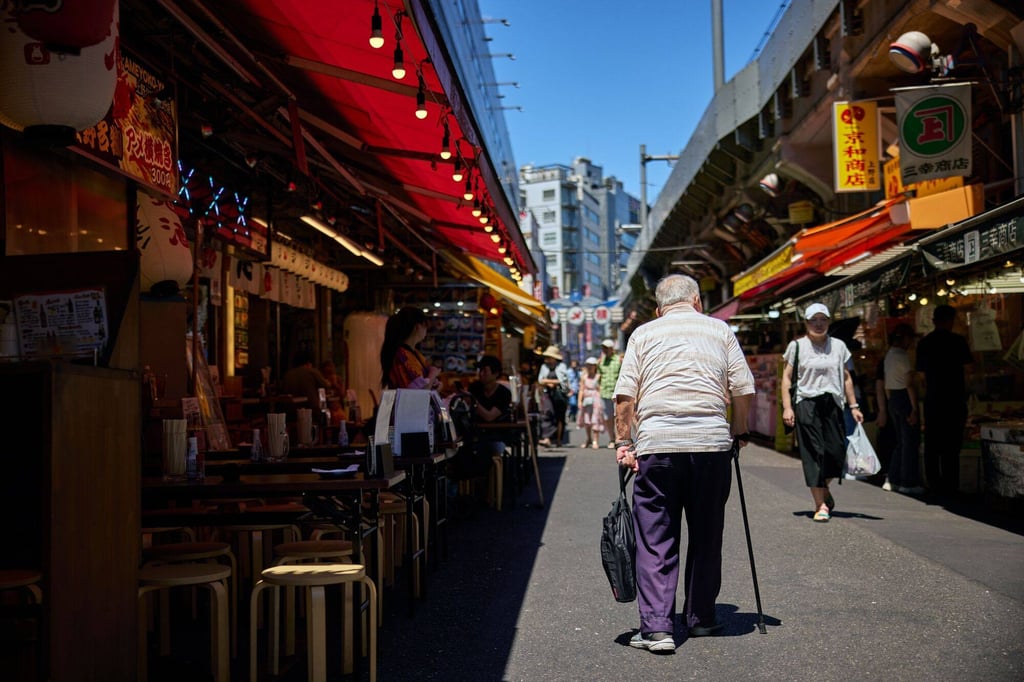 An elderly man in the Ueno area of Tokyo. Under the proposal, anyone who is over the age of 65 and has not used their bank card to access their account for more than a year would have it suspended. Photo: Bloomberg An elderly man in the Ueno area of Tokyo. Under the proposal, anyone who is over the age of 65 and has not used their bank card to access their account for more than a year would have it suspended. Photo: Bloomberg