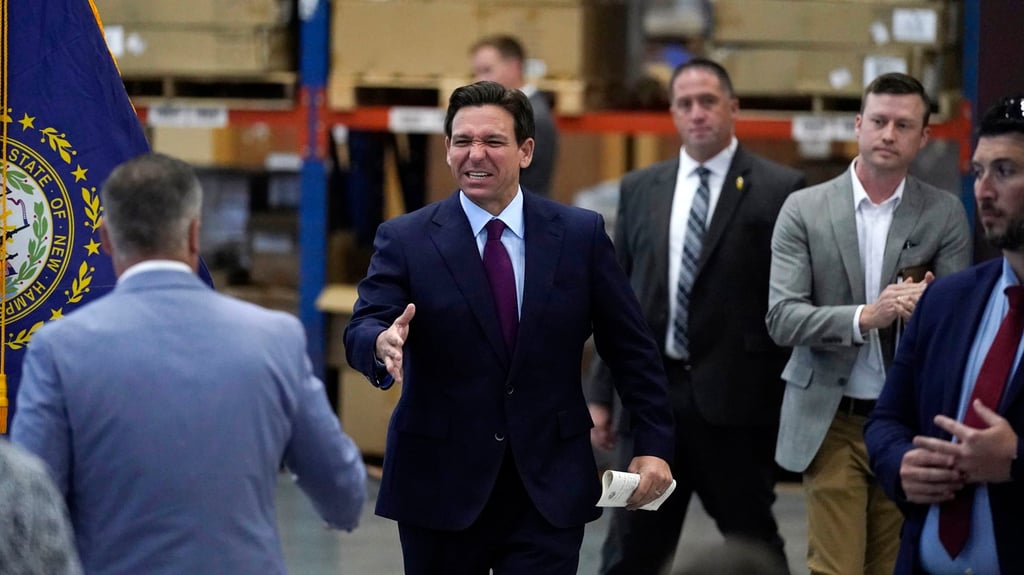 Ron DeSantis shakes hands during a campaign event on Monday in Rochester, New Hampshire. Photo: AP Ron DeSantis shakes hands during a campaign event on Monday in Rochester, New Hampshire. Photo: AP