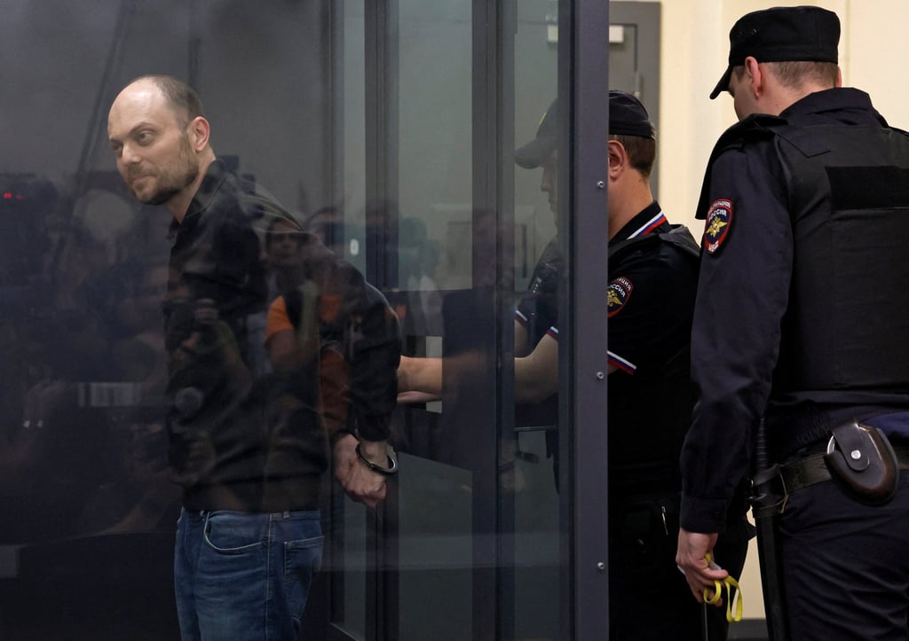 A police officer handcuffs Russian opposition figure Vladimir Kara-Murza during a court hearing in Moscow, Russia on Monday. Photo: Reuters