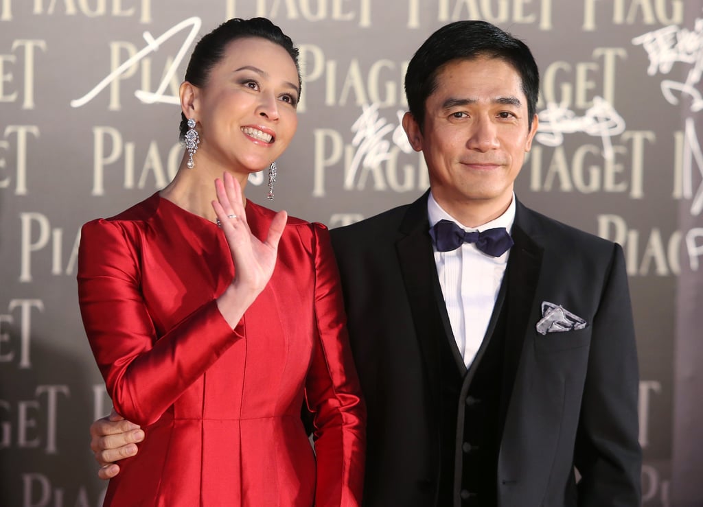 Actress Carina Lau and her husband actor Tony Leung Chiu-wai pose for photographers on the red carpet of the 32nd Hong Kong Film Awards at Cultural Centre in Tsim Sha Tsui. Photo: Sam Tsang