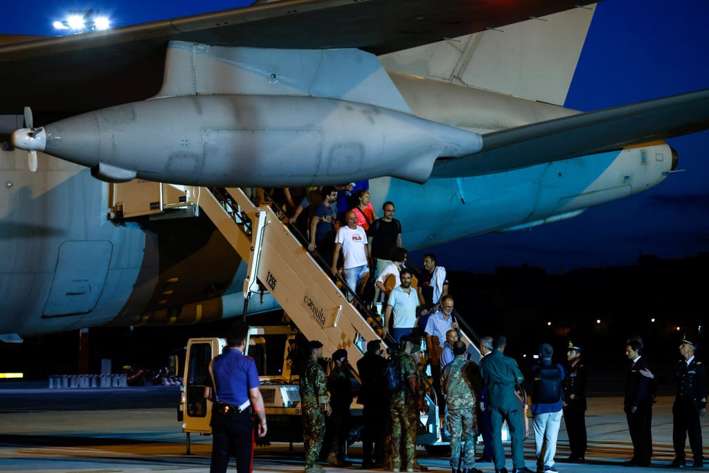 Italian nationals and other European and American citizens, who have been evacuated from Niger, arrive at Ciampino Airport, near Rome, Italy. Photo: Reuters Italian nationals and other European and American citizens, who have been evacuated from Niger, arrive at Ciampino Airport, near Rome, Italy. Photo: Reuters