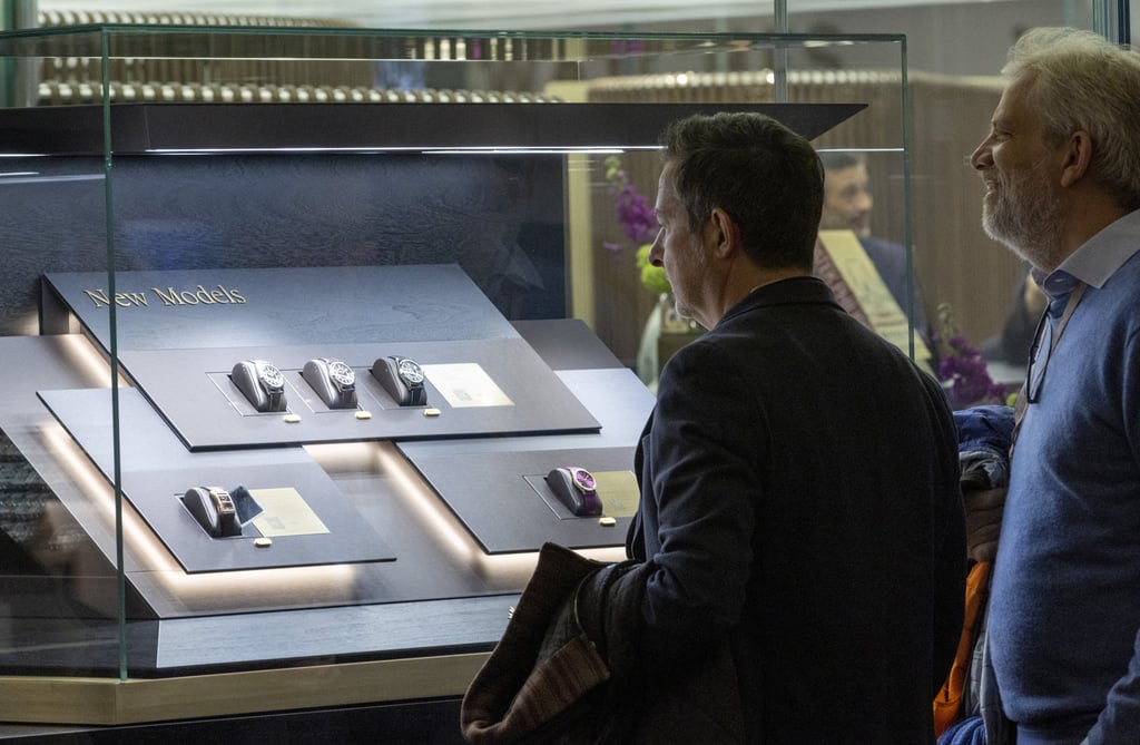Visitors look at models on the Patek Philippe booth during the Watches and Wonders fair in Geneva, Switzerland, on March 27. Photo: Reuters Visitors look at models on the Patek Philippe booth during the Watches and Wonders fair in Geneva, Switzerland, on March 27. Photo: Reuters