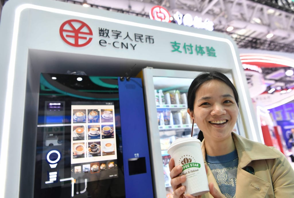 A visitor displays a cup of coffee bought with China’s digital yuan, or the e-CNY, at an exhibition of the 6th Digital China Summit in Fuzhou in April. Photo: Xinhua