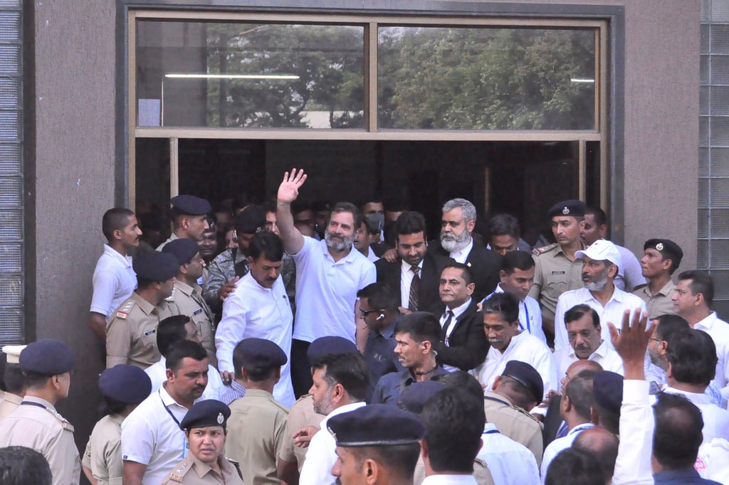 Rahul Gandhi waves to his supporters as he leaves the court. Photo: AP Rahul Gandhi waves to his supporters as he leaves the court. Photo: AP