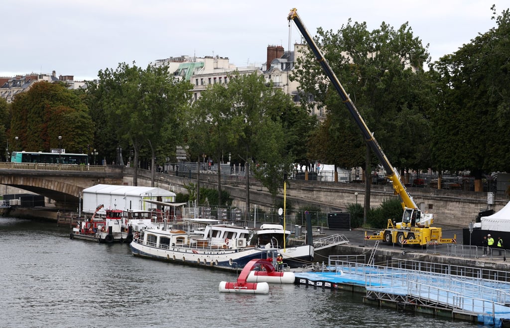 The river Seine, where the pre-Olympic swimming test was to be held, until its cancellation on Sunday. Photo: Reuters The river Seine, where the pre-Olympic swimming test was to be held, until its cancellation on Sunday. Photo: Reuters