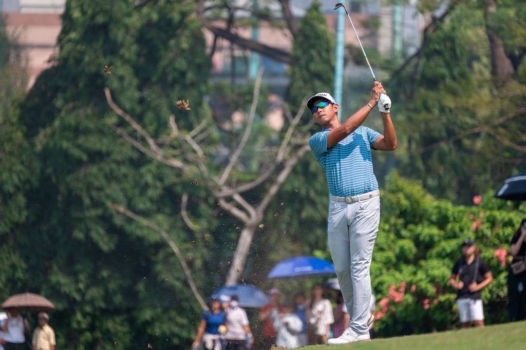 Nitithorn Thippong plays a shot during the fourth round at Pondok Indah golf course. Photo: AFP