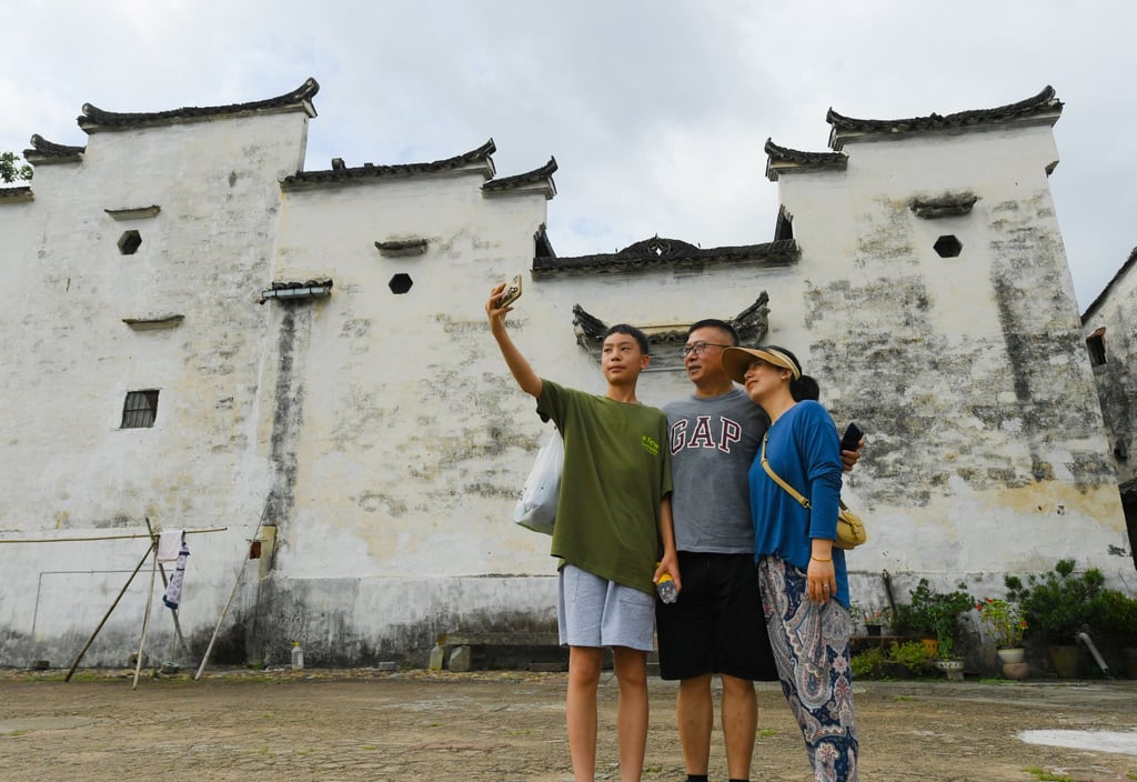 Tourists take a selfie at Zhuge Village in Lanxi City, in China’s Zhejiang province, on August 1, 2023. Photo: Xinhua Tourists take a selfie at Zhuge Village in Lanxi City, in China’s Zhejiang province, on August 1, 2023. Photo: Xinhua