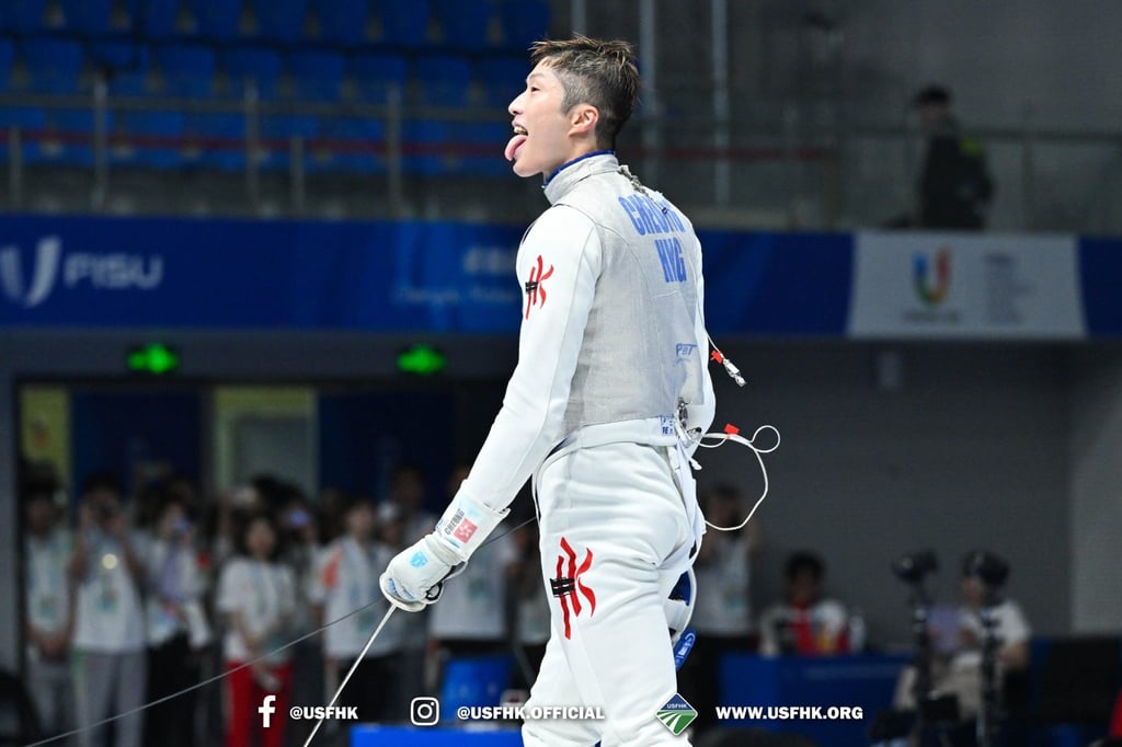 Cheung Ka-long makes his signature celebration pose after winning men’s foil individual gold in Chengdu. Photo: USFHK