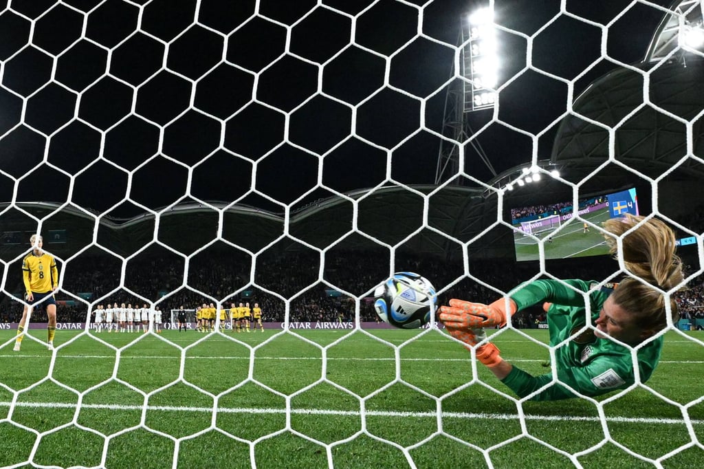 US goalkeeper Alyssa Naeher stops Lina Hurtig’s penalty only for it to creep over the line. Photo: AFP