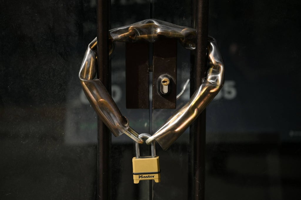 A padlocked door. Lim bought a padlock to lock the only door to his old workplace because he was resentful about being fired, the court heard. Photo: AFP