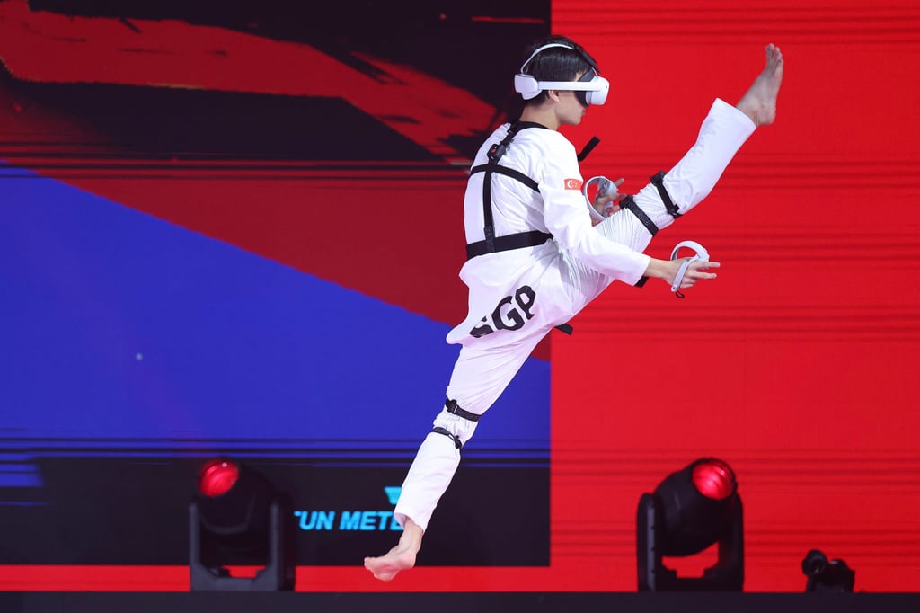 Natalie Tor of Team Singapore competes against compatriot Nigel Tan in the Virtual Taekwondo final match on day four of the Olympic Esports Week at Suntec Singapore Convention & Exhibition Centre in June. Photo: Getty Images Natalie Tor of Team Singapore competes against compatriot Nigel Tan in the Virtual Taekwondo final match on day four of the Olympic Esports Week at Suntec Singapore Convention & Exhibition Centre in June. Photo: Getty Images