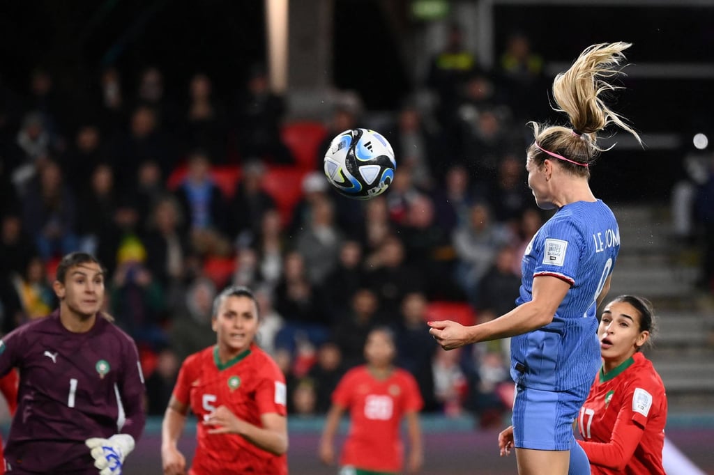 France forward Eugenie Le Sommer scores her team’s fourth goal. Photo: AFP
