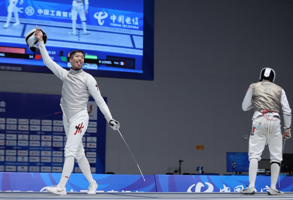 Fencer Cheung Ka-long celebrates after winning the gold medal for Hong Kong in the men’s individual foil competition at the Fisu World University Games in Chengdu, China, on Friday.
