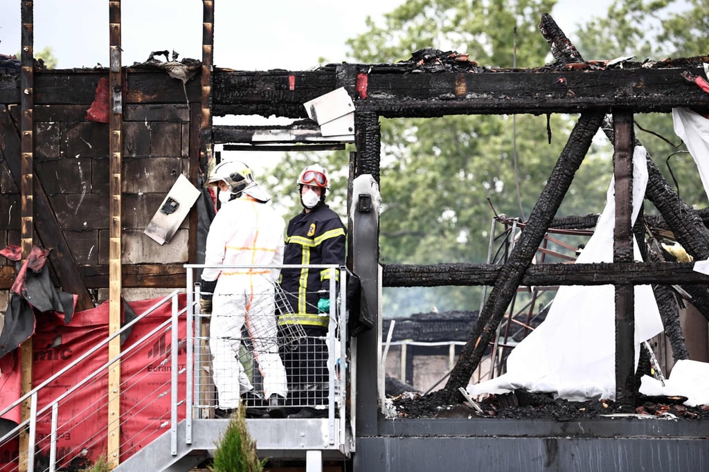 Firefighters search a holiday home for disabled people in eastern France on Wednesday after a fire ravaged a building that housed adults with disabilities. Photo/AFP