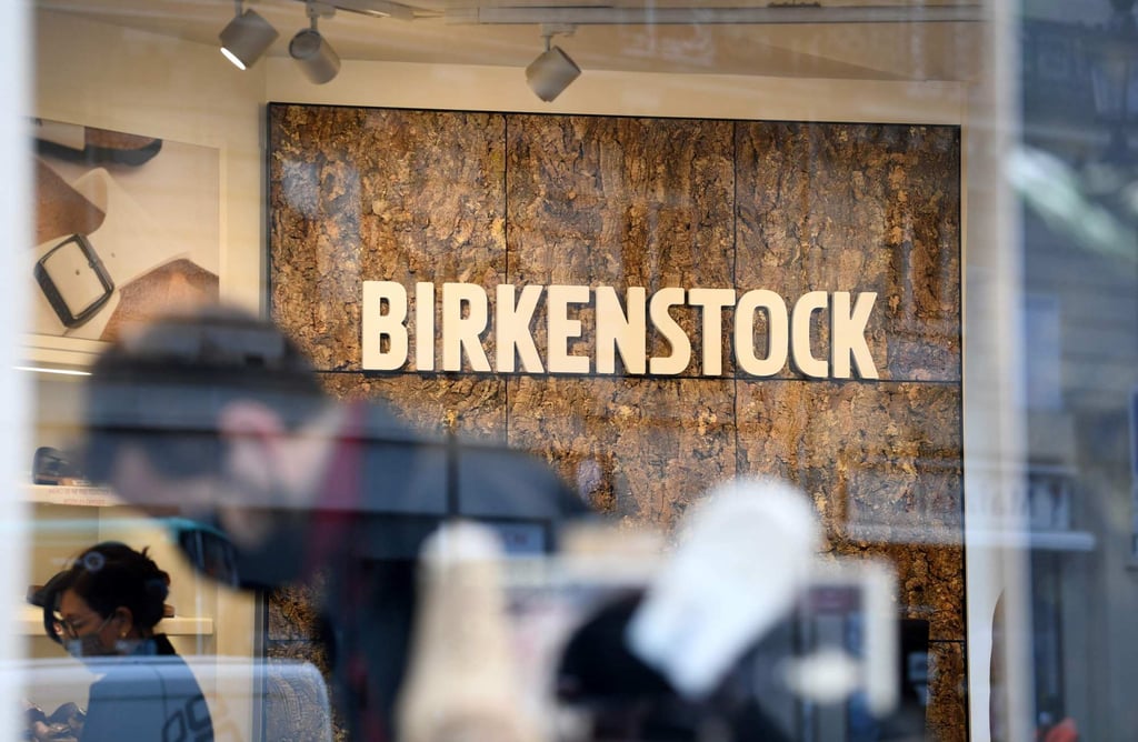 Customers look at displays at a Birkenstock outlet in Paris, in February 2021. Photo: AFP