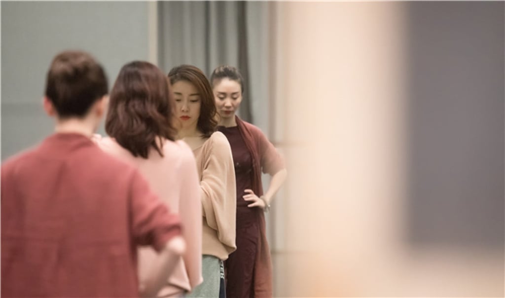 Choreographers Zhou Liya and Han Zhen work with members of the ballet troupe on the production. Photo: courtesy China Oriental Performing Arts Group.