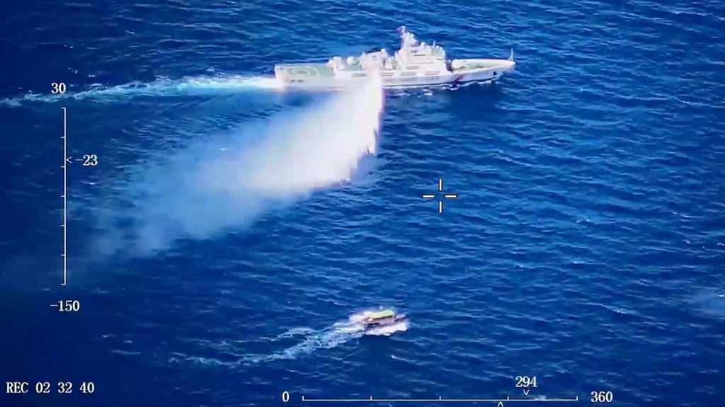 A Chinese Coast Guard ship launches what it says is a warning water cannon spray in the direction of a Philippine vessel as seen in a screen grab from a video released on August 8. Photo: China Coast Guard A Chinese Coast Guard ship launches what it says is a warning water cannon spray in the direction of a Philippine vessel as seen in a screen grab from a video released on August 8. Photo: China Coast Guard
